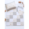 Farm Friends patchwork baby quilt with matching pillowcase and bandana bibs flat lay