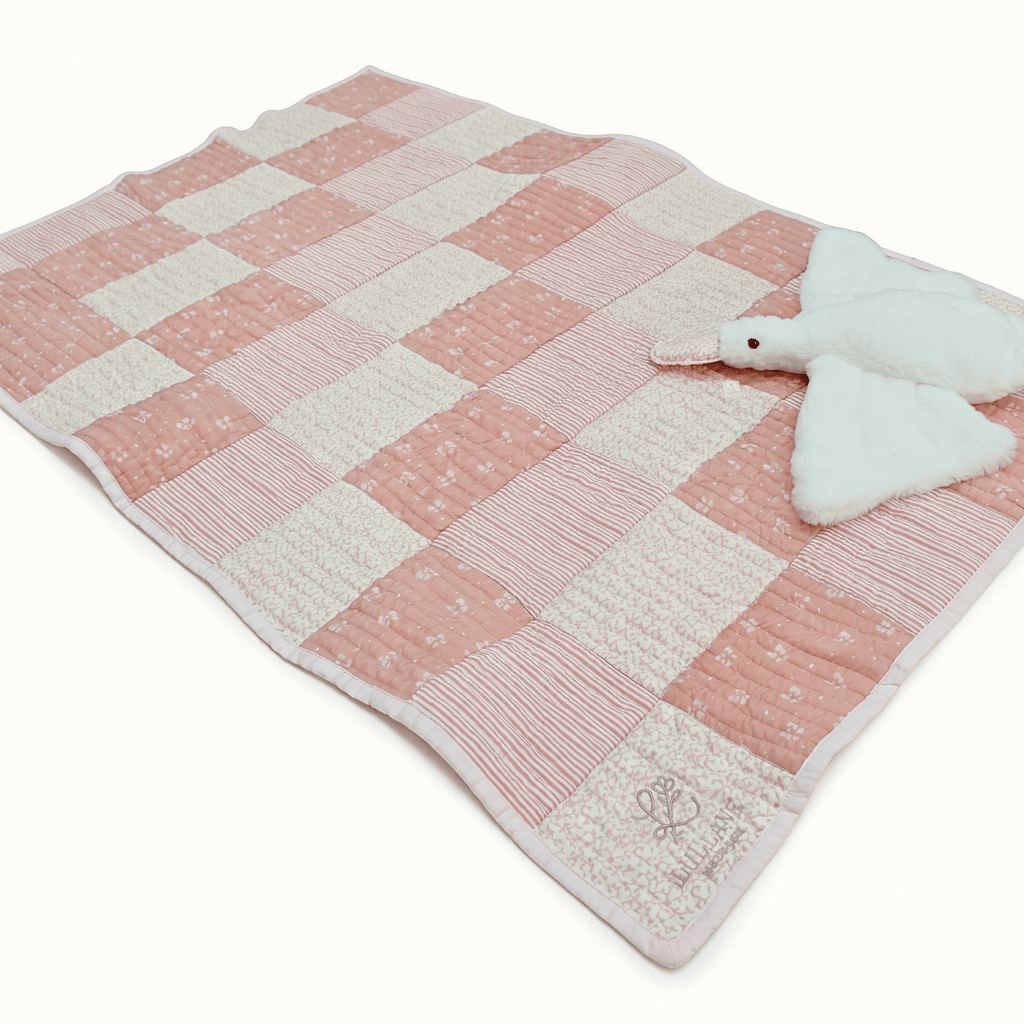 Little Darling Personalised Baby Quilt Gift Set featuring a handcrafted quilt in pastel pink and white.