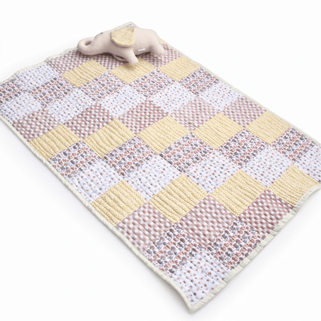 personalised handmade Little Elly baby quilt set featuring a colorful patchwork design with a soft toy elephant.
