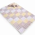 personalised handmade Little Elly baby quilt set featuring a colorful patchwork design with a soft toy elephant.