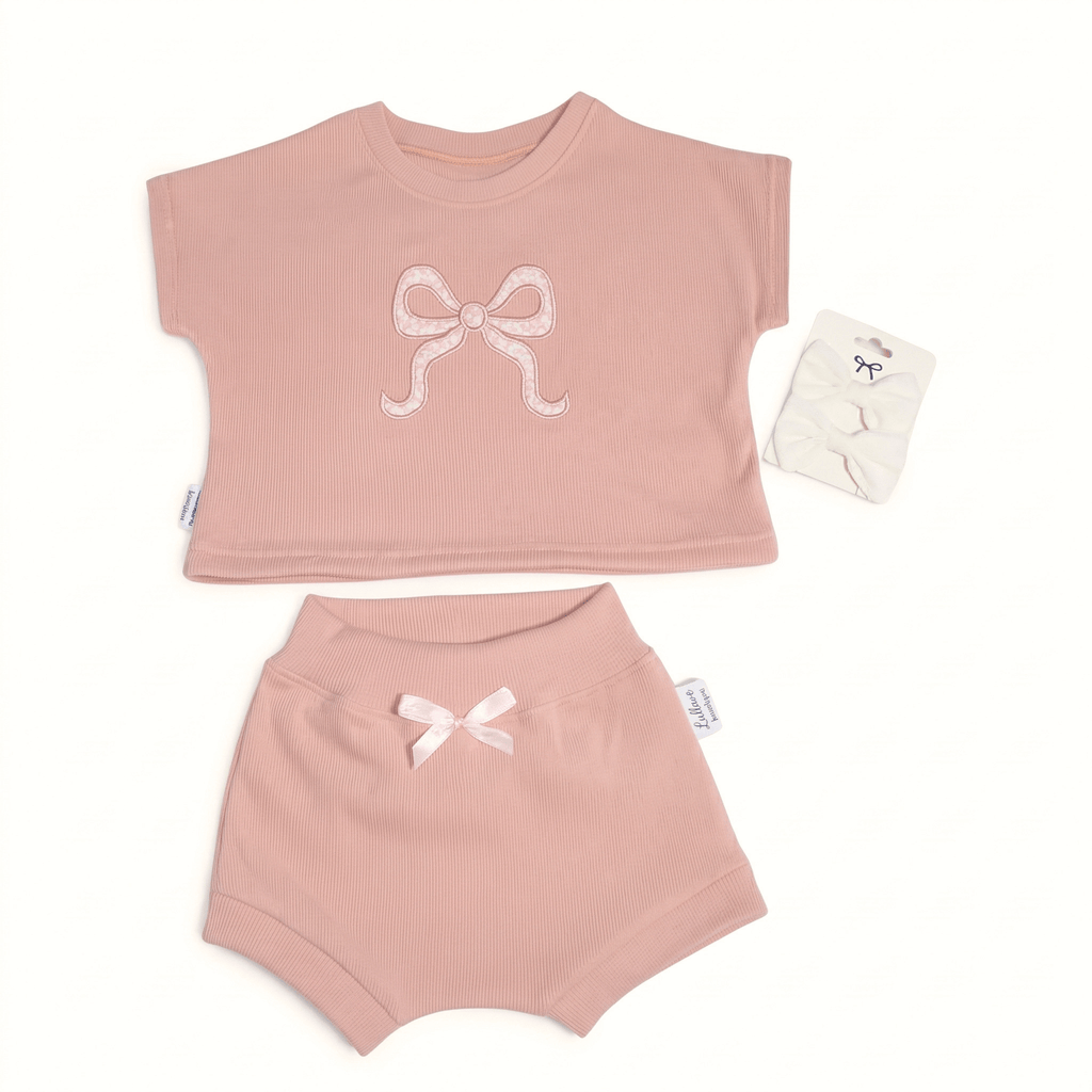 Rosewood set- cotton baby girl set featuring a soft blush-pink top with a bow and matching shorts.