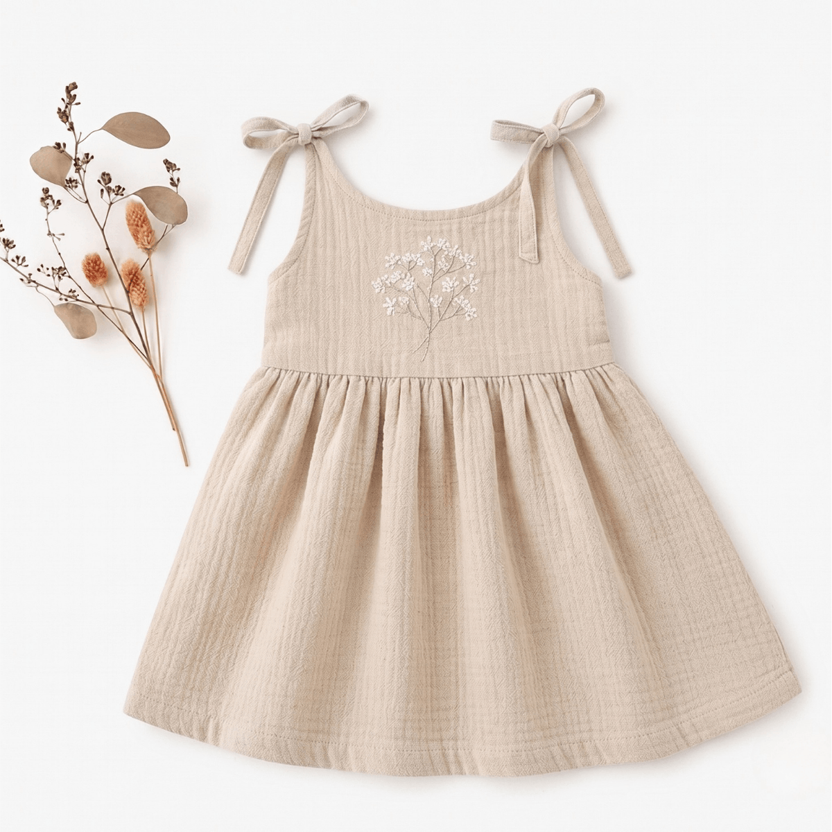 Muslin Baby Dress Claire Soft Handmade Clothing featuring a floral design, designed for comfort and style for toddlers.