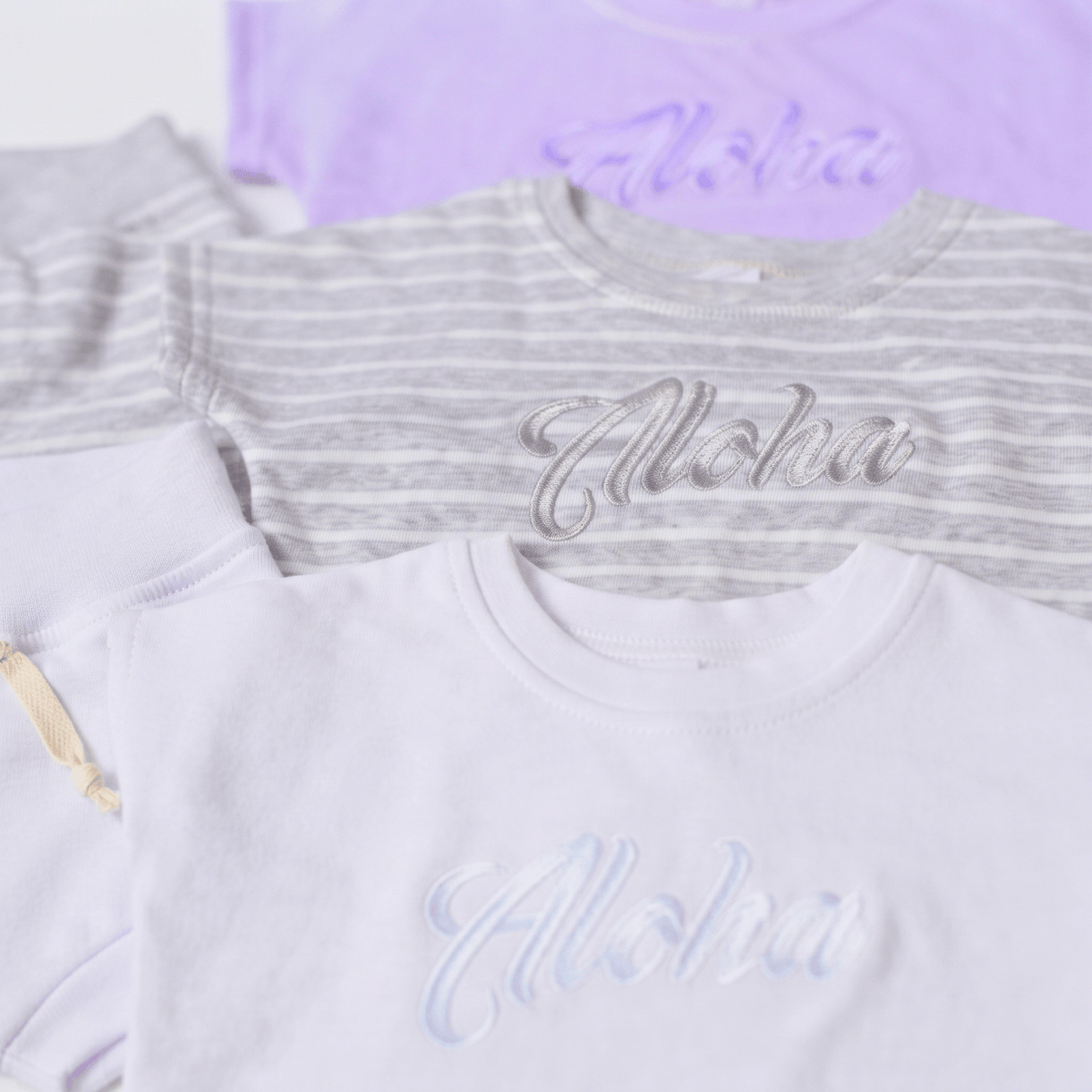 Aloha Keiki Baby Set - Stylish & Comfortable Babywear featuring soft cotton shirts in pastel colors.