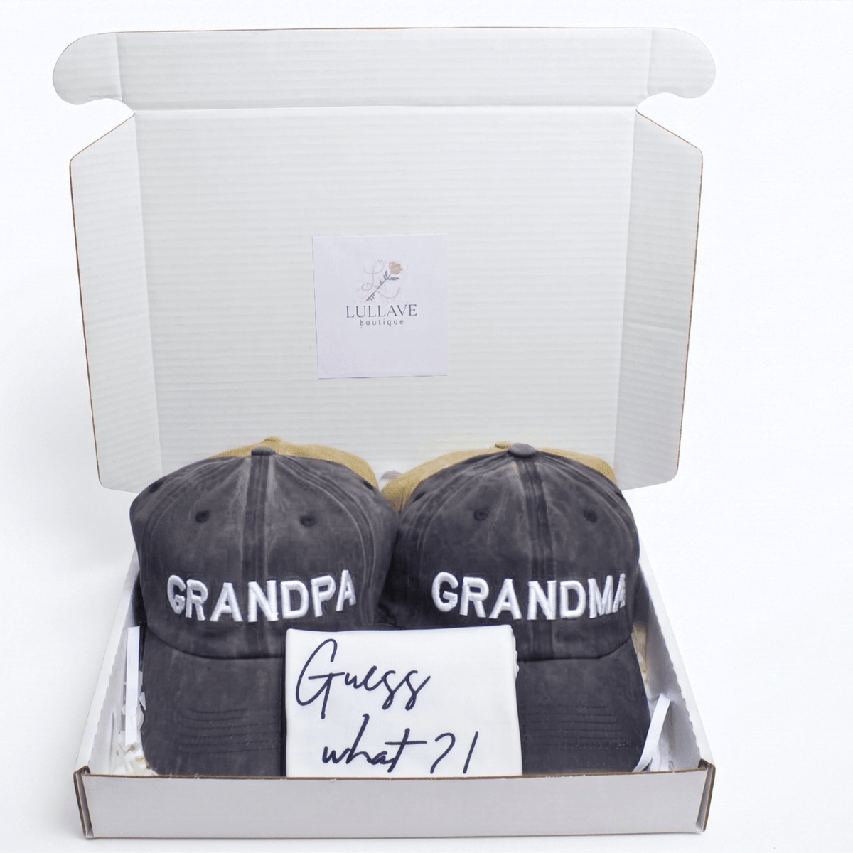Guess What New Parents Announcement Cap Gift Box with grandparent hats and a note.